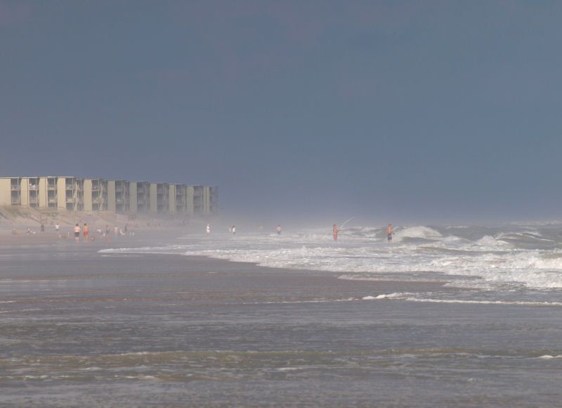 hazy beach as the storm rolls in