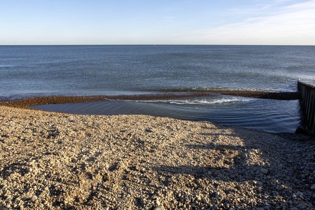 The filling of a pool on beach 66, Eastbourne, East Sussex