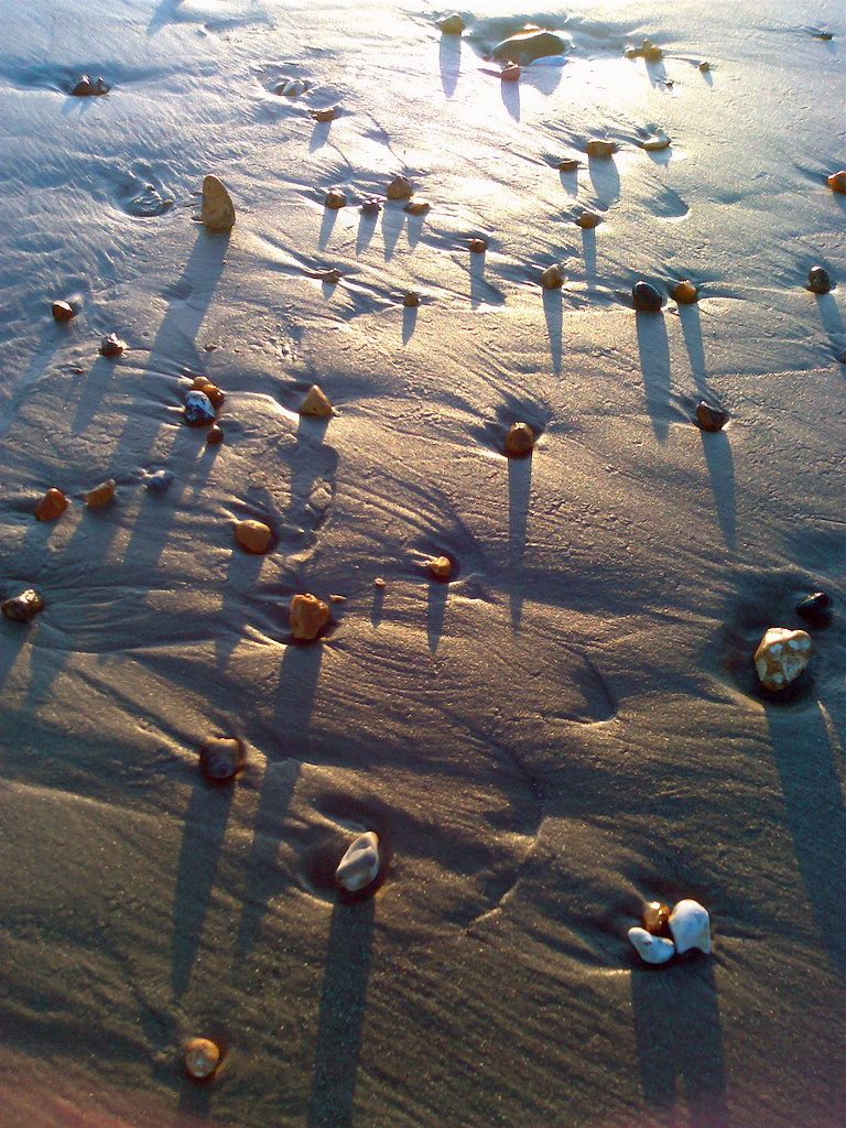 pebbles, shadows and water.