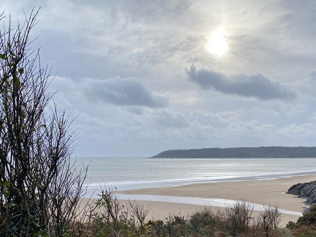 Watery sun over Oxwich Bay