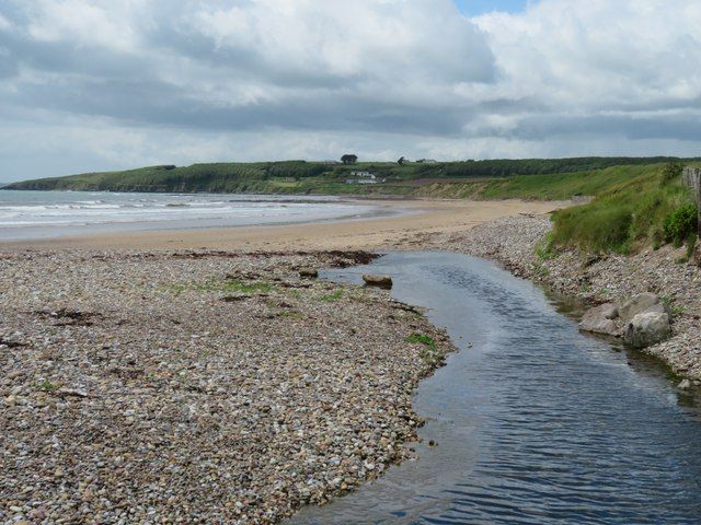 A stream reaches the beach at Whiting Bay