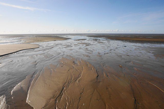 Water draining off the beach