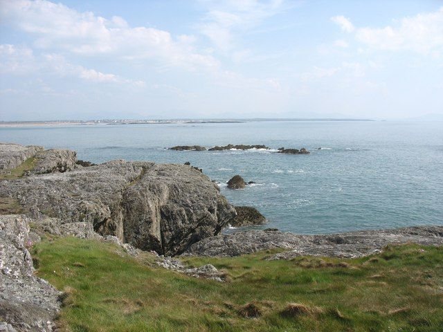 View across an indented coastline towards the offshore reef