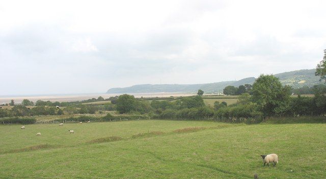 View eastwards across grazing land towards Red Wharf Bay