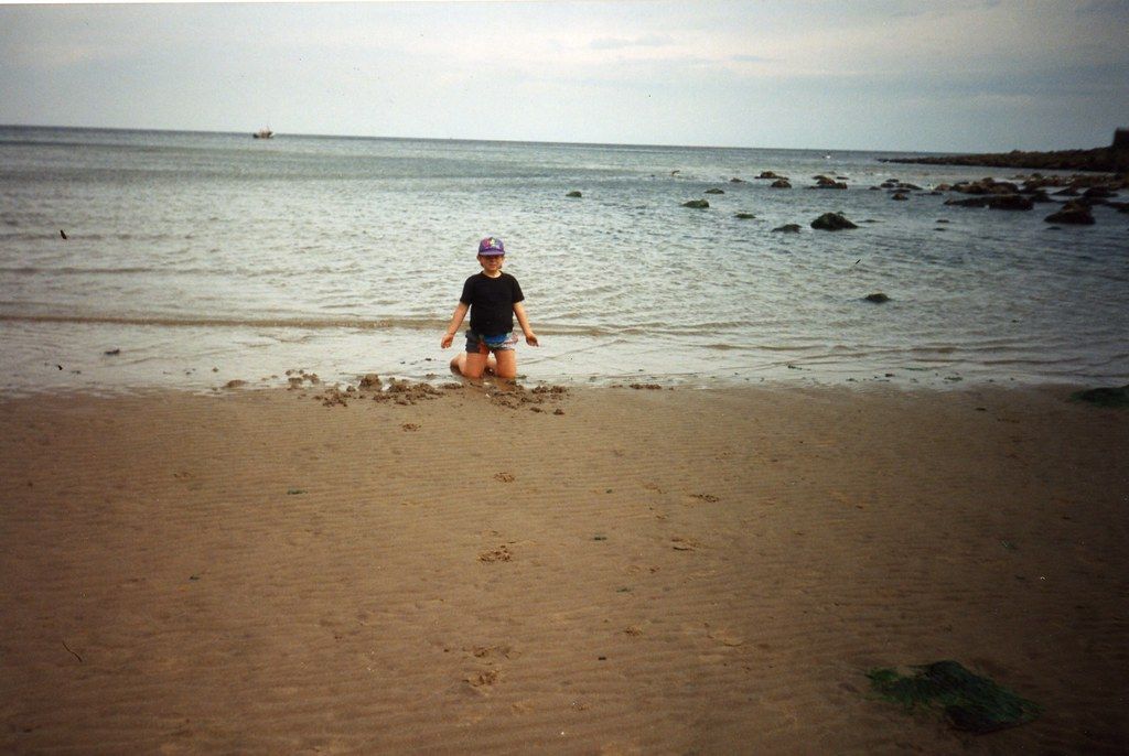 Sam flying a kite on Scarborough beach