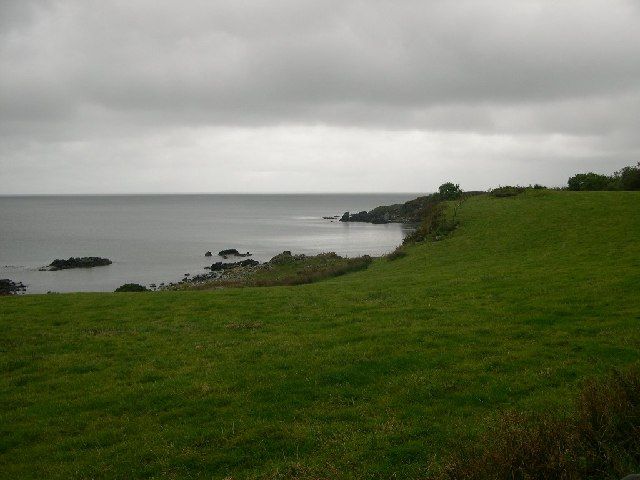 Looking across Black Bay towards Carrick Point, Kintyre.