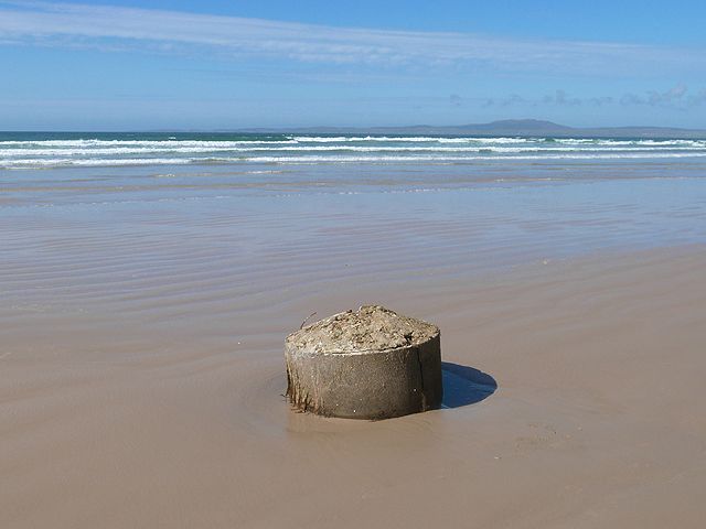 Concrete cylinder on the beach
