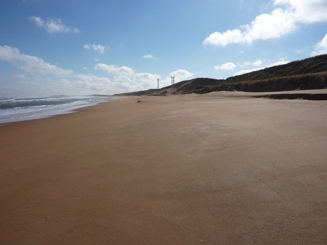 Sun sea sand and sky, and St Fergus Gas Terminal