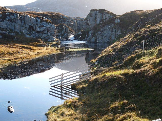 A river tumbles down to Uig Bay